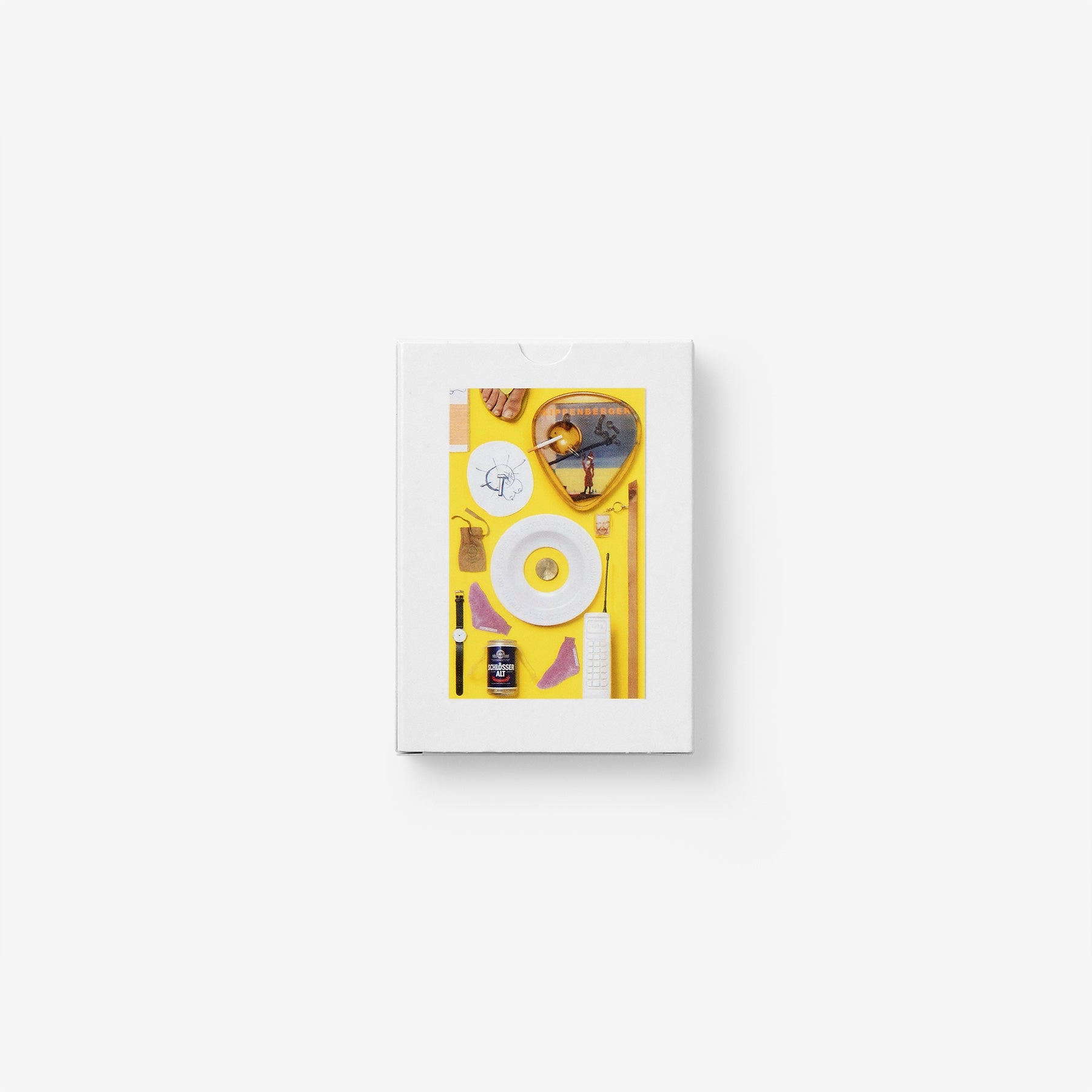 A collection of nine Kippenberger editions, one Boetti watch, a cigarette and yellow by Jonathan Monk